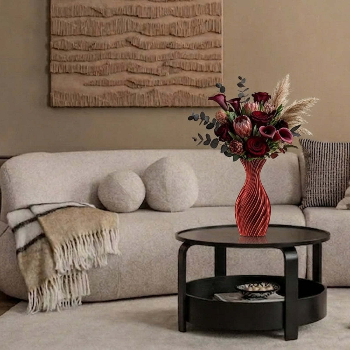 Red vase with flowers on coffee table in living room