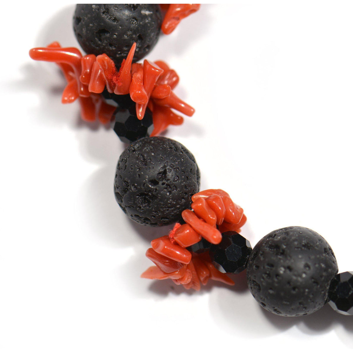 Bracelet with red coral, lava stone, and onyx